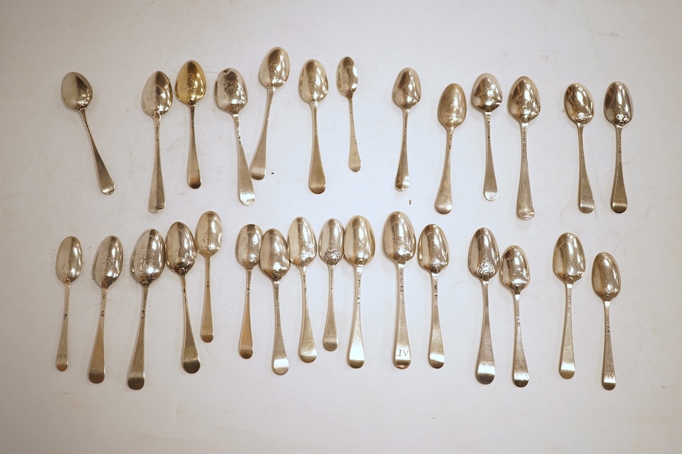 A collection of twenty nine assorted Georgian picture back teaspoons, various dates and makers, including three with masted ship, some marks indistinct, 10.2oz.